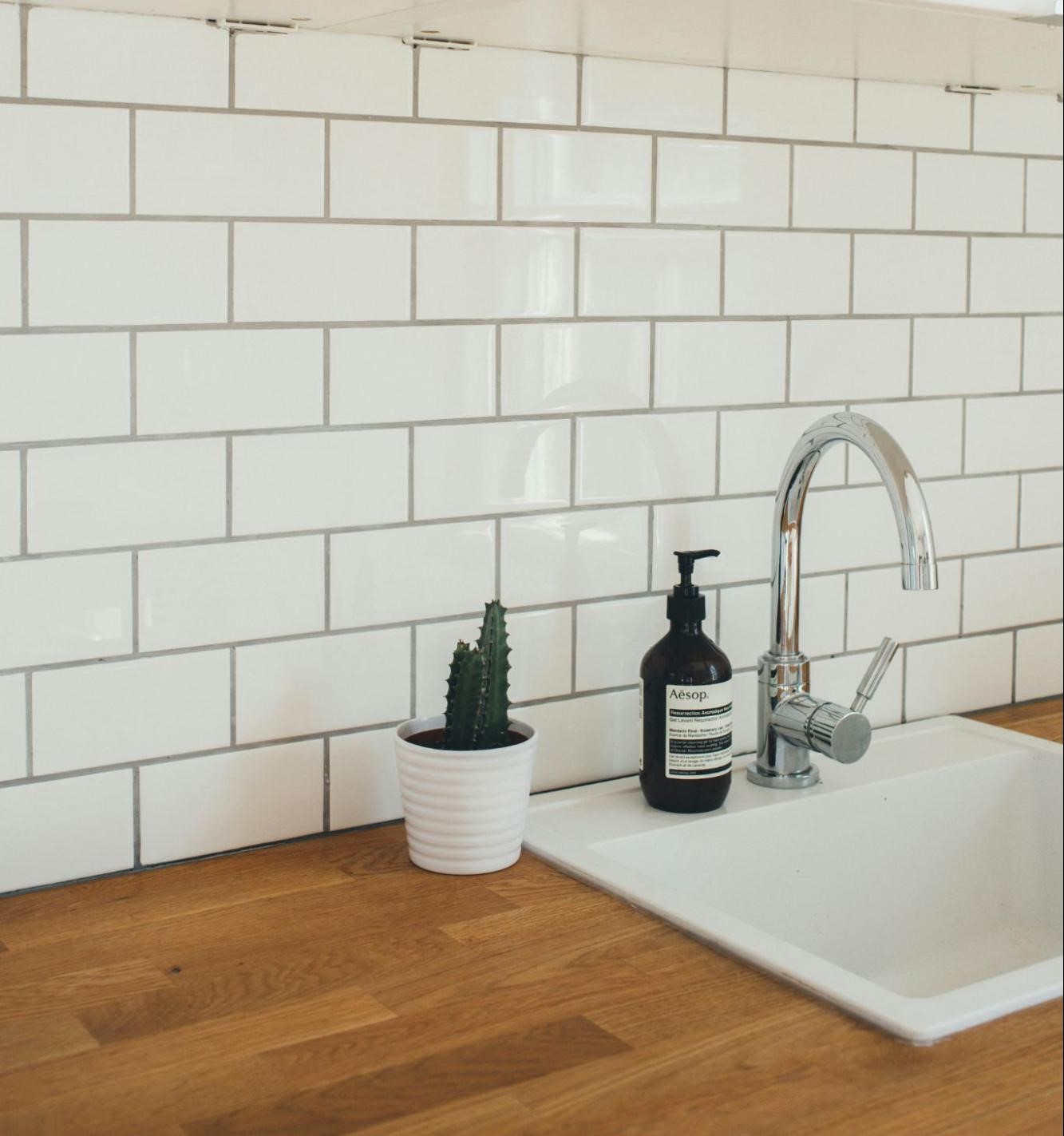 white grouted tiles in kitchen