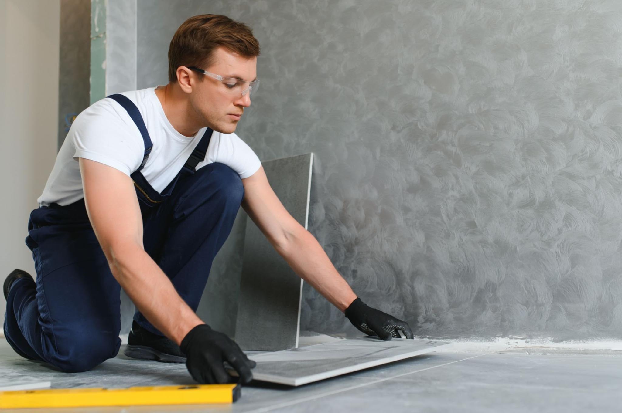 person installing tiles