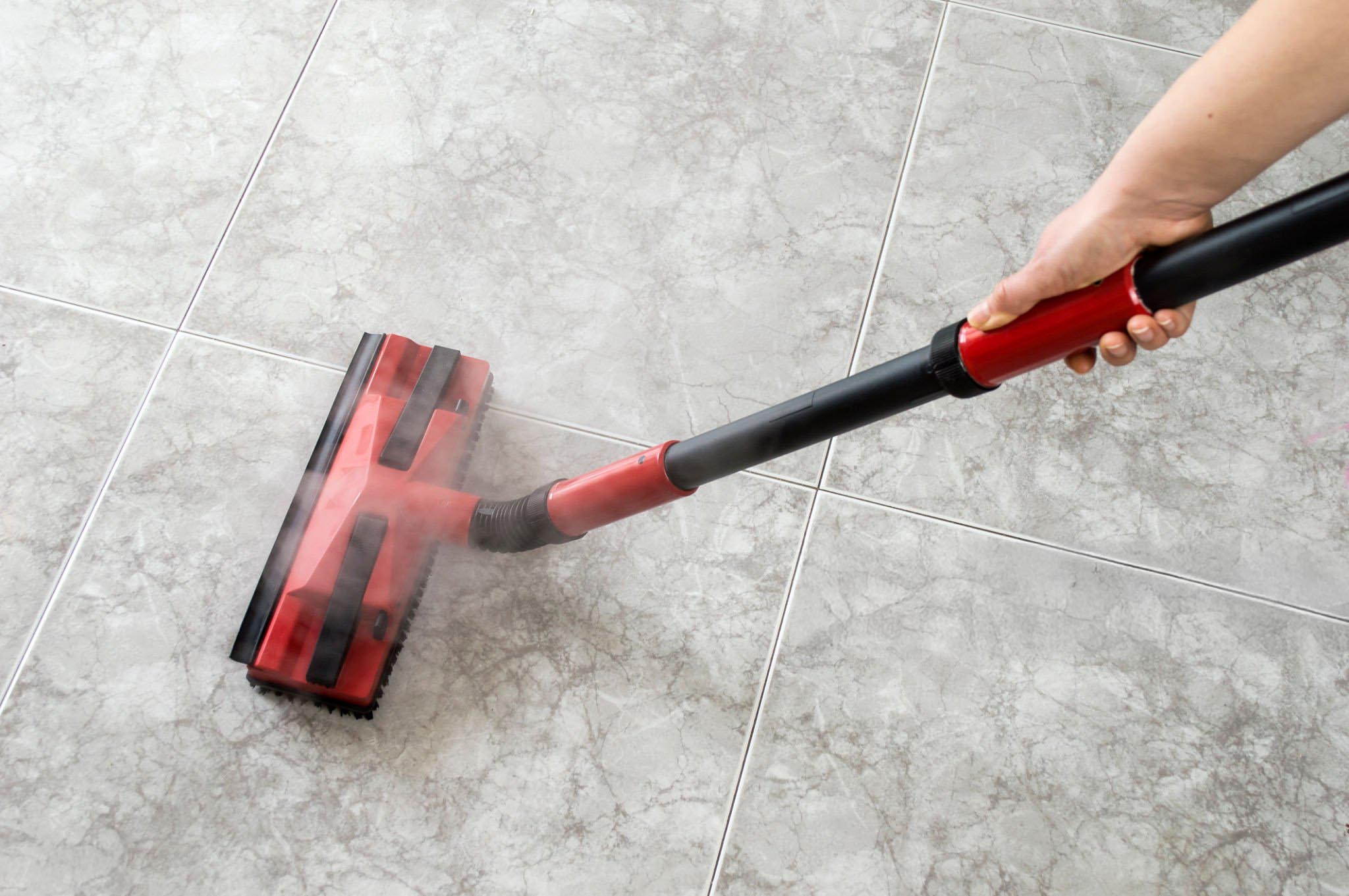 woman cleaning floor tiles