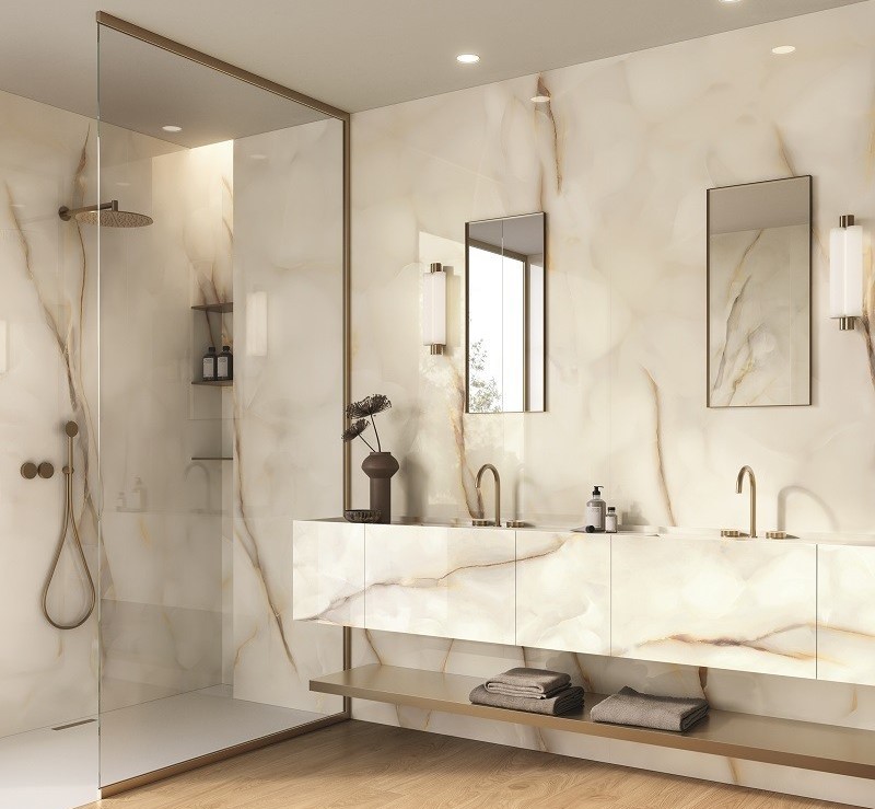 Luxurious bathroom with marble walls, flooring, and stylish tile accents.